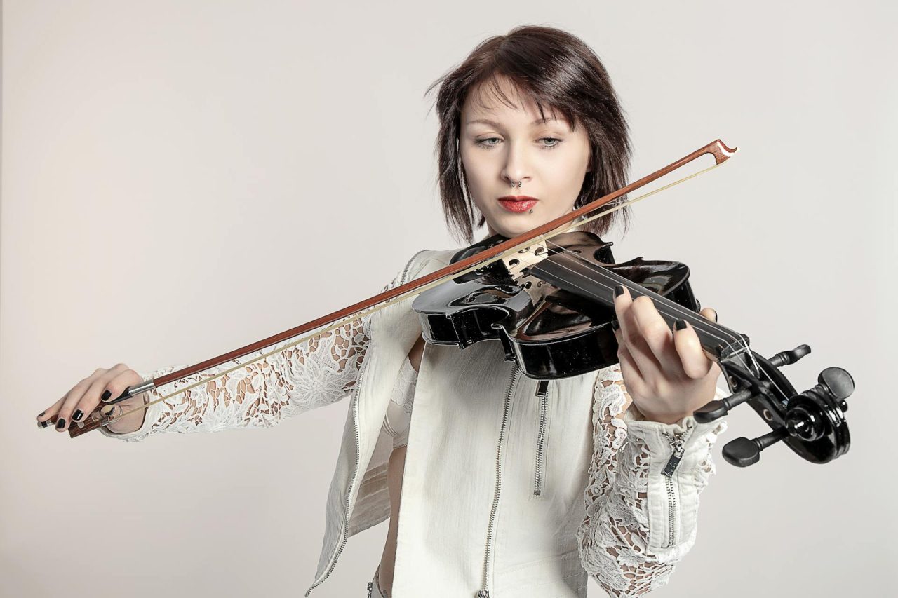 Professional violinist performing at an elegant event in Singapore