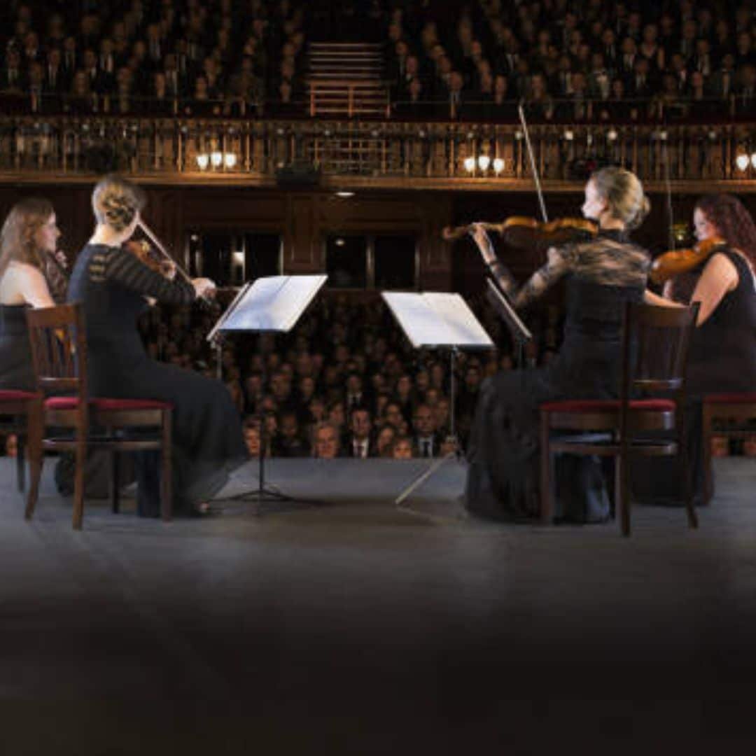 String quartet performing on a concert stage in Singapore String quartet performing on a concert stage in Singapore