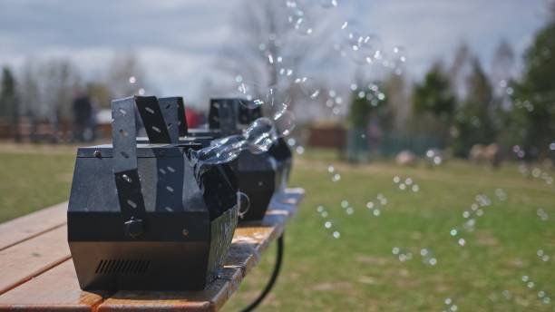 Bubble machines blowing bubbles at an outdoor event