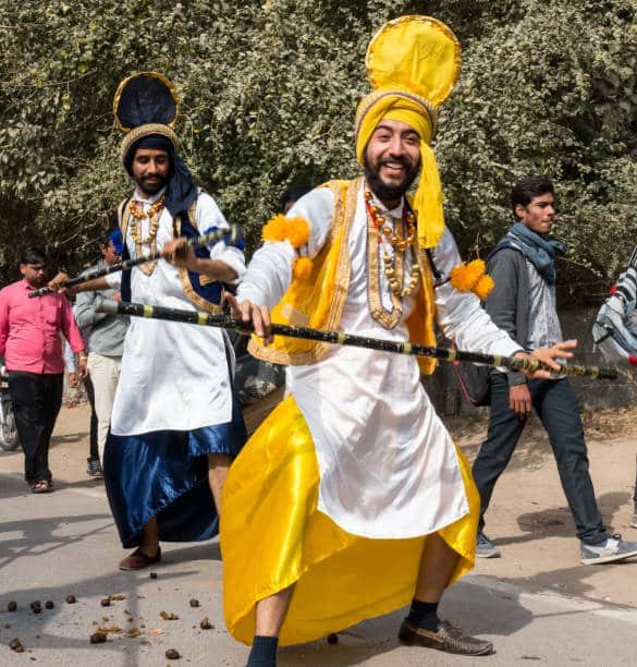 Bhangra dancers performing with a dhol in Singapore