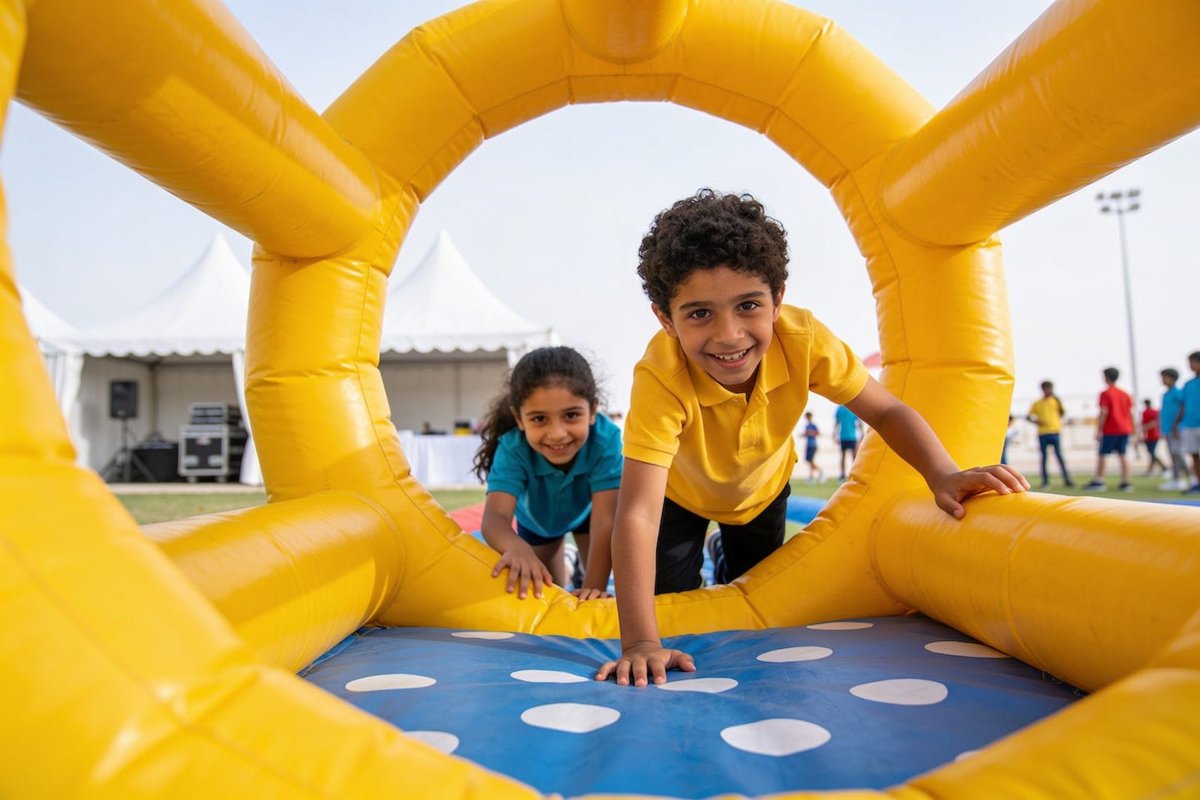 Kids crawling through an inflatable obstacle course